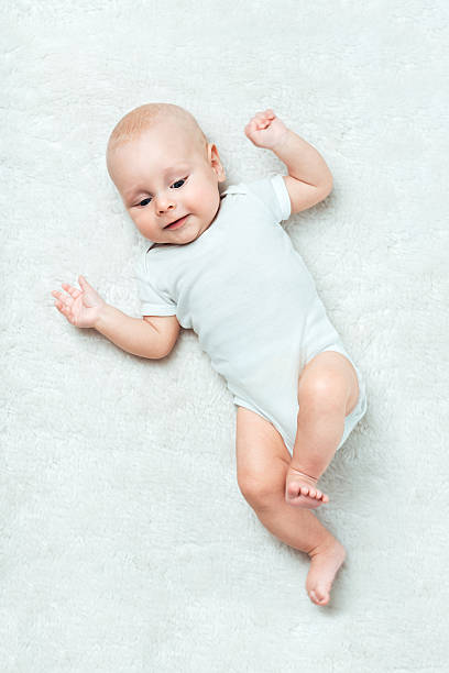 istock Pretty baby  is lying on the carpet 452742051