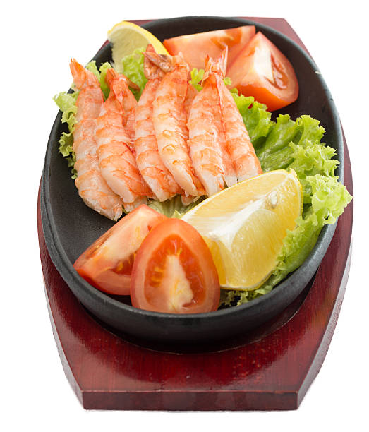 istock fried shrimp with vegetables on plate isolated 452743659