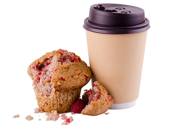 To-go cup of coffee and crumbled raspberry muffin