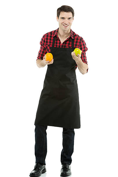 istock Man catching an orange and a apple 452746215
