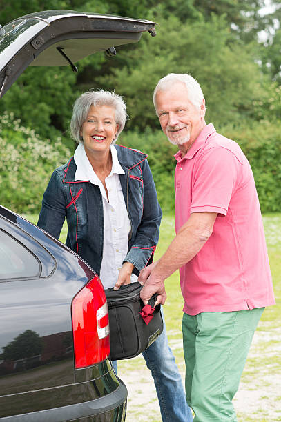 istock Senior couple with luggage 452753273