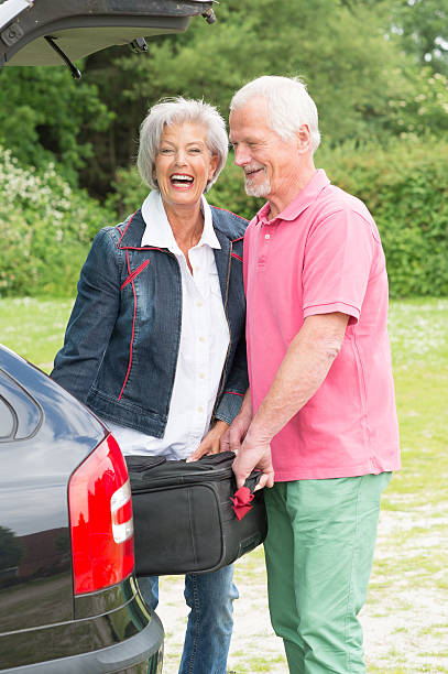 istock Senior couple with luggage 452753291