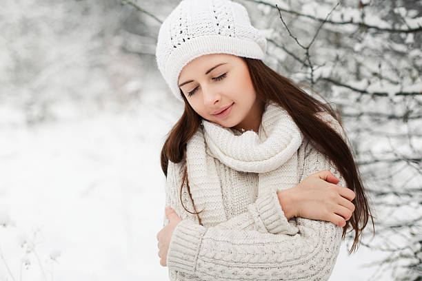 Young dreaming woman in winter stock photo