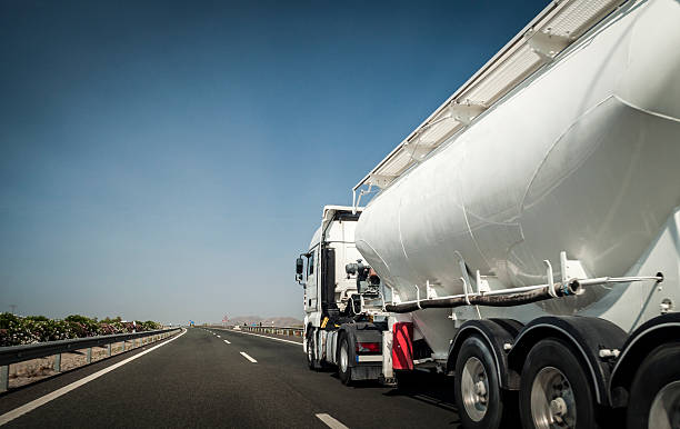 istock White tanker truck on the freeway 452760953