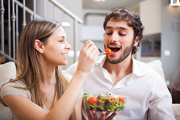 istock Couple eating a salad 452761477