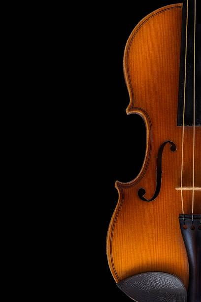 istock Half of a violin with dark background 452761629