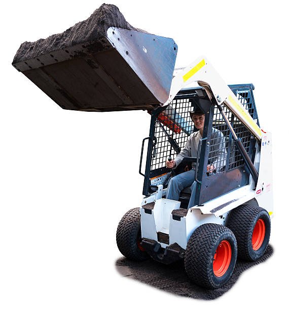 Woman Driving a Bobcat loader, isolated on white stock photo