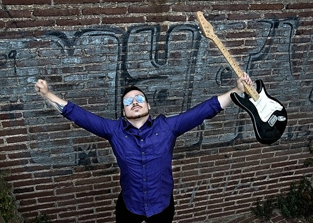 musician posing with his guitar