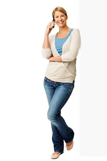 istock Woman Answering Smart Phone While Leaning On Billboard 452770587