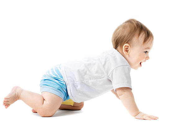 istock baby in a shirt crawling and laughing 452771895
