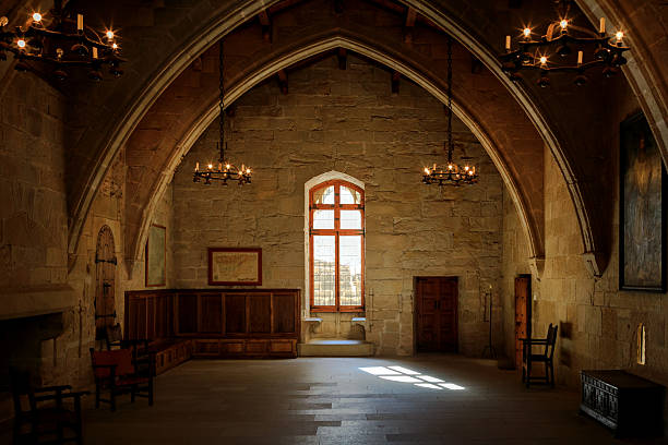 Dark old room Dark old room in Poblet cloister with stained glass window and candelabra, Spain castle photos stock pictures, royalty-free photos & images