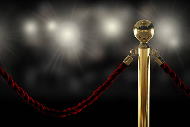 Red rope barrier close-up Red velvet rope barrier close-up with flash light on background red carpet event photos stock pictures, royalty-free photos & images
