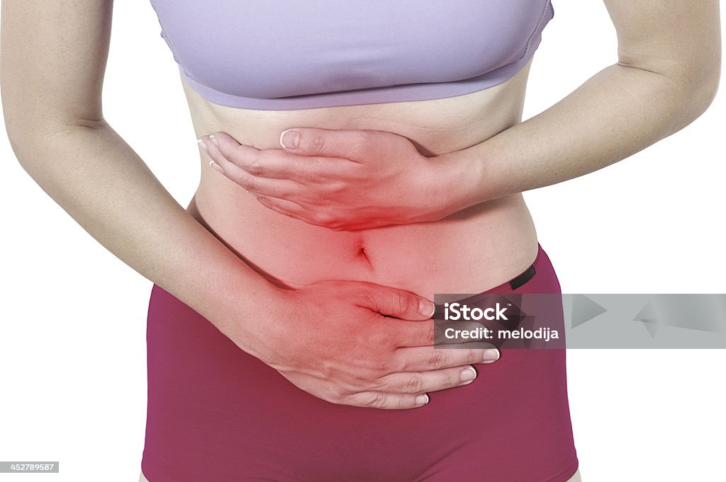 Dolor agudo en una mujer de estómago - Foto de stock de Adulto libre de derechos