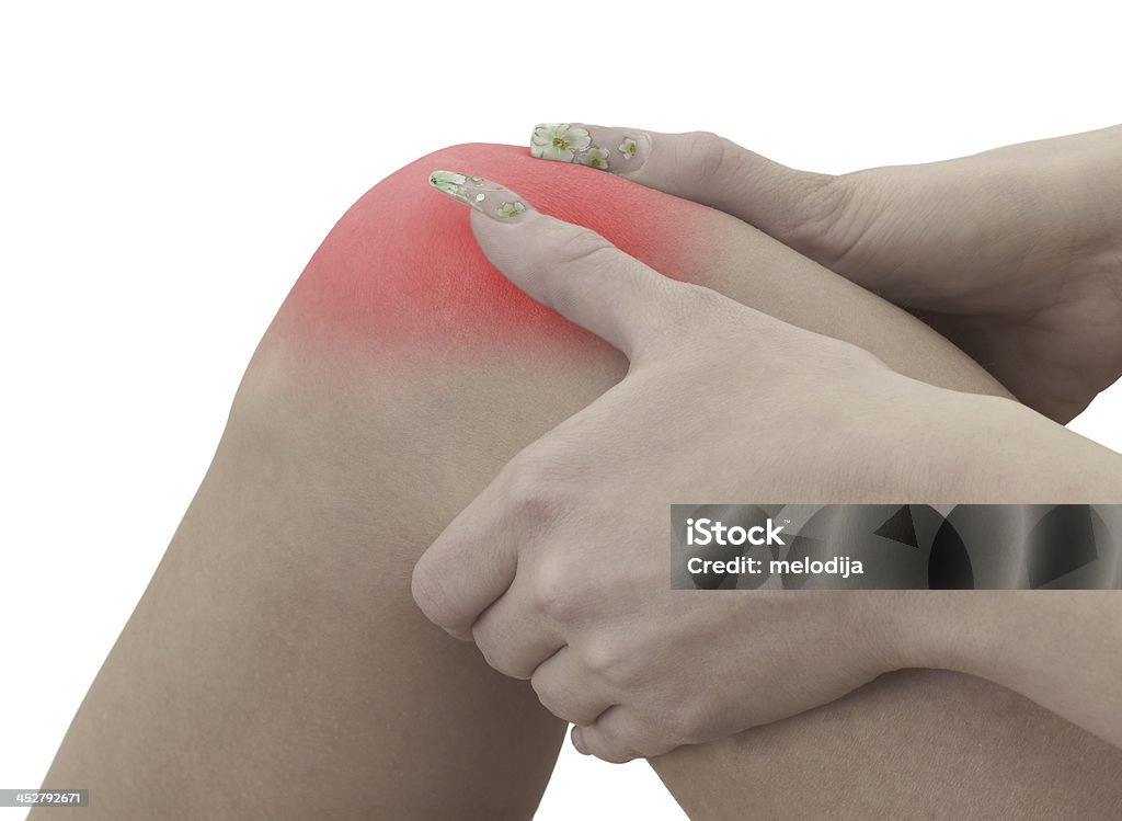 Dolor de la rodilla de una mujer - Foto de stock de Adulto libre de derechos