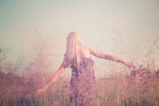 istock Girl having fun in summer field 452794473