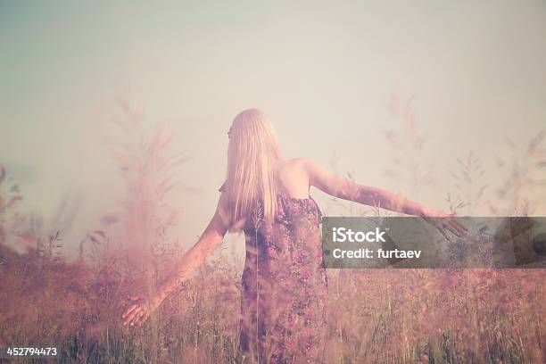 Girl Having Fun In Summer Field Stock Photo - Download Image Now - Agricultural Field, Flower, Teenage Girls