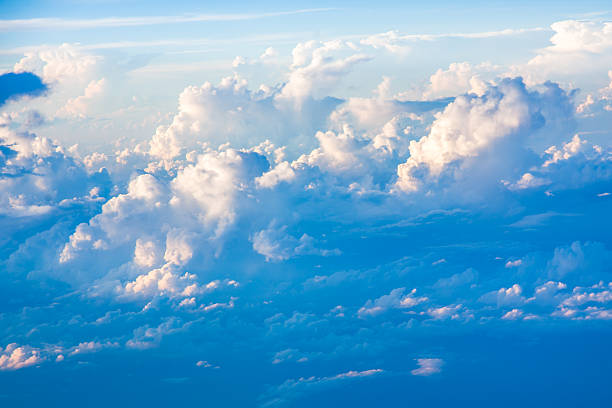 istock Clouds and sky as seen through window of an aircraft 452799489