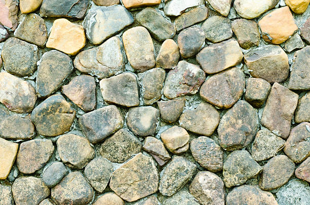 istock Closeup rough big rock wall for background 452799847