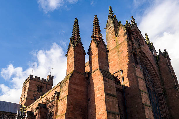 Carlisle Cathedral, with its gothic spires, from the southeast in late afternoon sunlight.