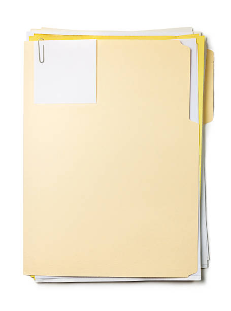 manila folder with documents, sticky note and paper clip - akte envelop stockfoto's en -beelden