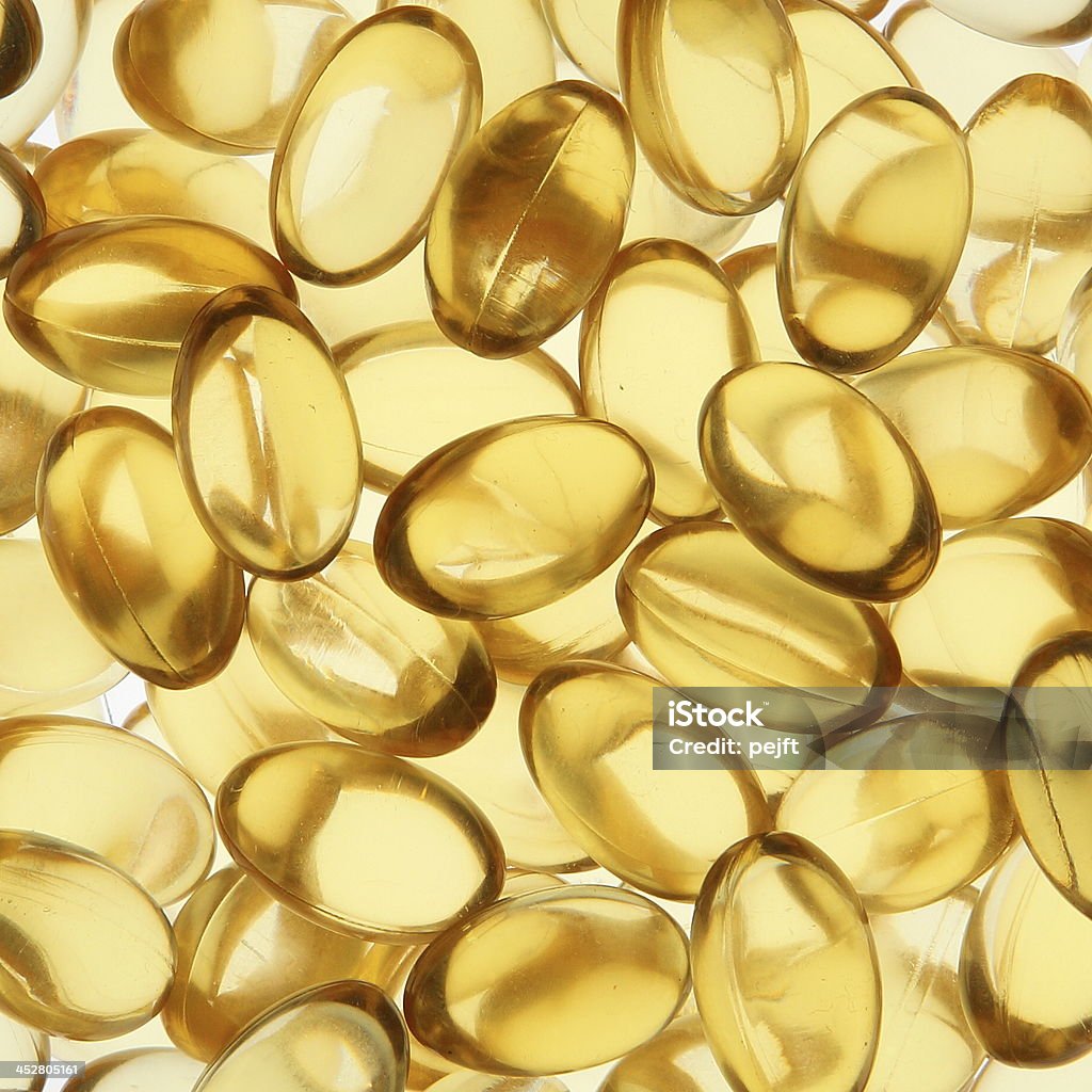 Golden-gel vitamin Omega - 3 Fischöl Kapseln - Lizenzfrei Bildhintergrund Stock-Foto