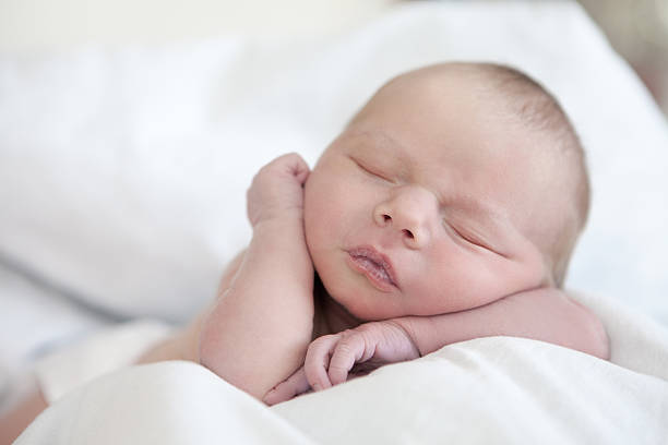 istock Sleeping Newborn Baby Girl 452862905