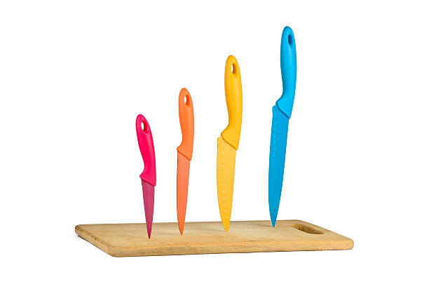 istock Knives standing upright on the board 452954975