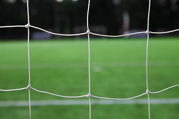 istock white football net and green grass 452955415