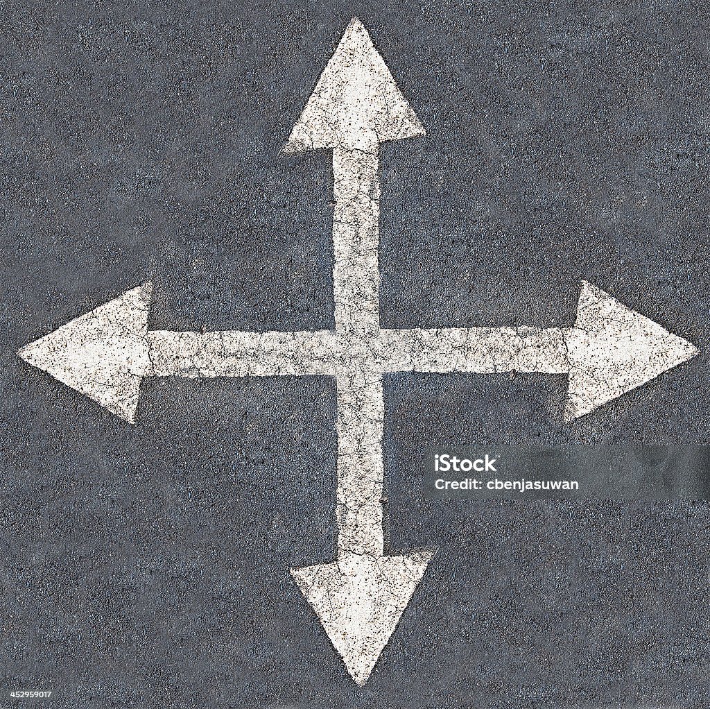 White arrow 4 direction on the road background Accessibility Stock Photo