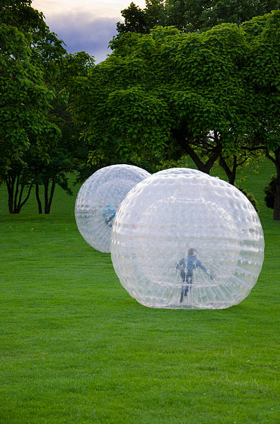 istock Kids are Zorbing in a Park 452966741