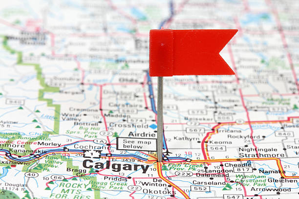 Calgary Calgary in Alberta, Canada. Red flag pin on an old map showing travel destination. road map of canada stock pictures, royalty-free photos & images