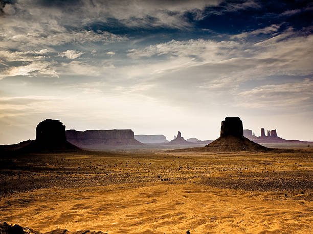 giant Buttes, formations  made of sandstone in the Monument vall sunset inMonument Valley in Arizona, seen from the gigantic Stone figures from Artists point david merrick photos stock pictures, royalty-free photos & images