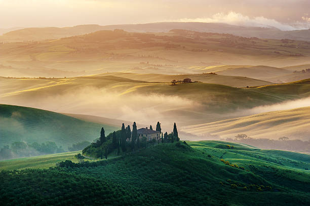 istock Foggy and sunny morning in Tuscany 452969351