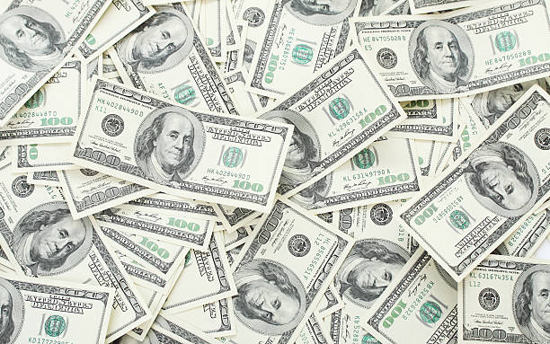 Background with money american hundred dollar bills Background with money american hundred dollar bills - horizontal bringing home the bacon stock pictures, royalty-free photos & images