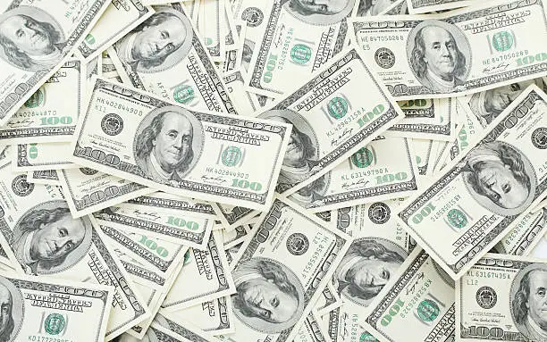 Photo of Background with money american hundred dollar bills