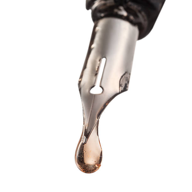 istock drop of transparent liquid on tip pen 452970949