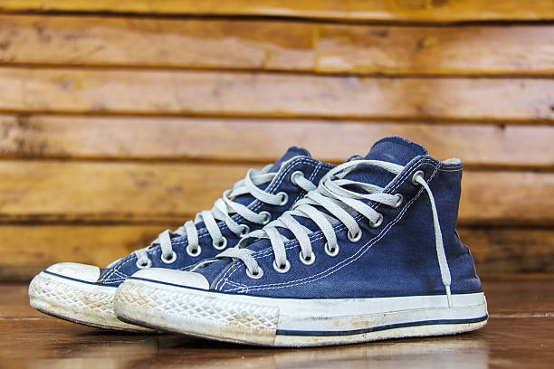 istock blue sneakers on the wooden floor 452974875