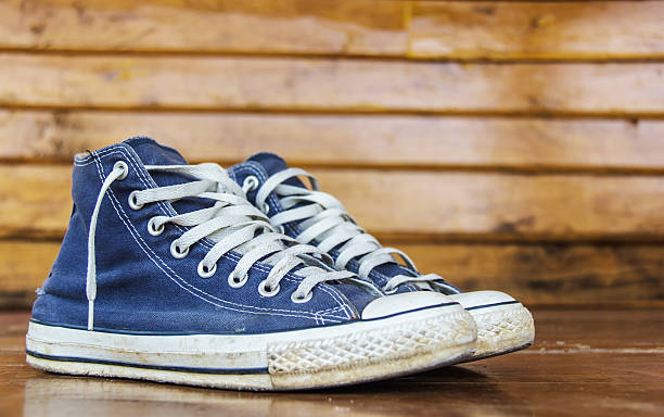 istock blue sneakers on the wooden floor 452975381