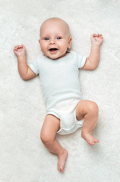 istock Pretty baby  is lying on the carpet 452978221