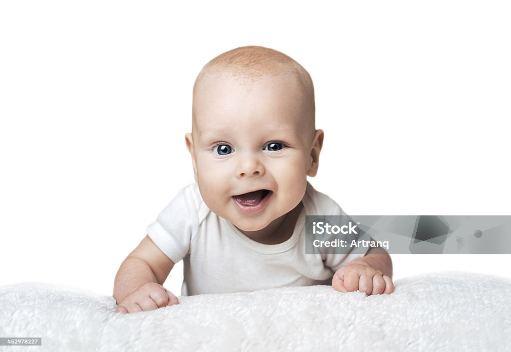 Piccolo bambino sul tappeto Sorridere in modo compiaciuto - Foto stock royalty-free di Allattare - Mondo animale