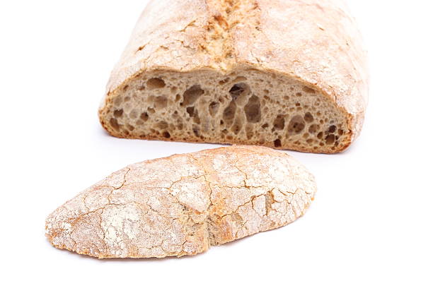 istock Slice of rye bread and loaf in background 452981545