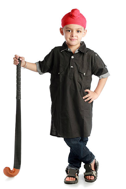 istock Sikh child with hockey stick 452985329