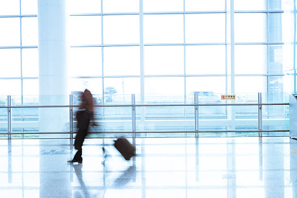 istock Futuristic Airport interior people walking in motion blur 452986645