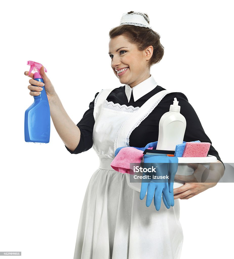 Ready to cleaning Portrait of vintage maid holding cleaning products. Studio shot, white background. 1920-1929 Stock Photo