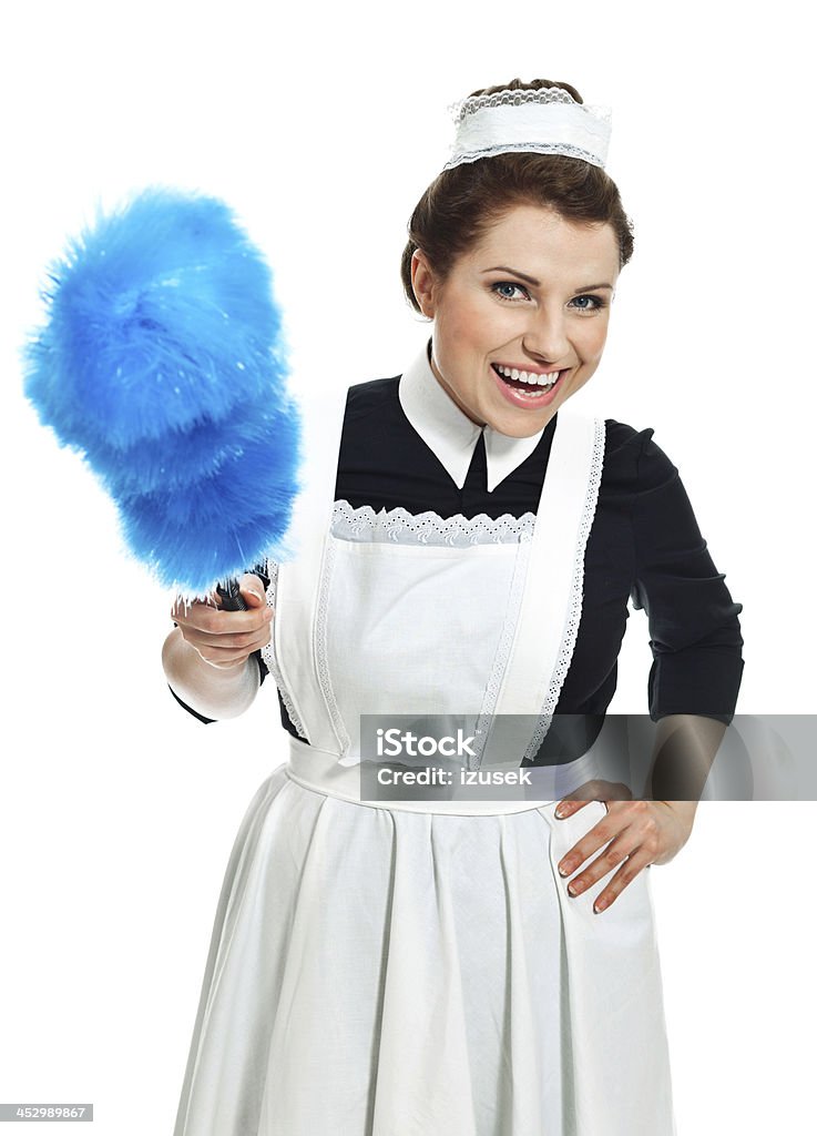 Victorian style Maid Portrait of vintage maid holding a duster and laughing at camera. Studio shot, white background. 1920-1929 Stock Photo Victorian style Maid Portrait of vintage maid holding a duster and laughing at camera. Studio shot, white background. 1920-1929 Stock Photo