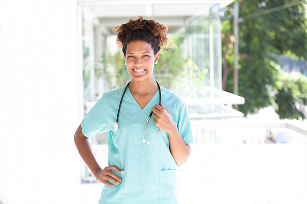 Health care worker with stethoscope Health care worker with stethoscope and smiling emergency room photos stock pictures, royalty-free photos & images