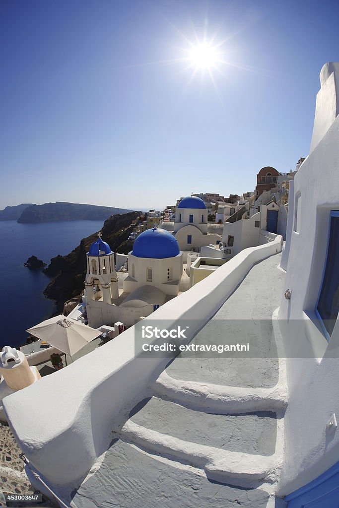 Oia village in Santorini island with famous churches,  Greece Oia village in Santorini island with churches,  Greece Aegean Sea Stock Photo