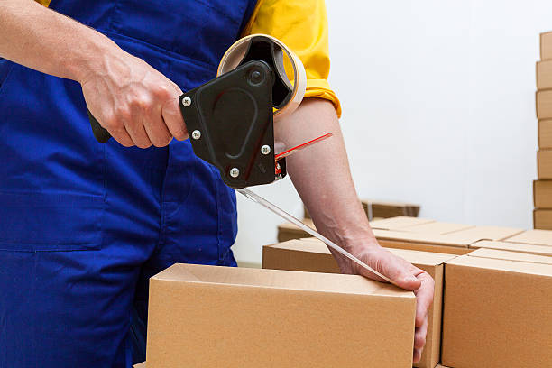 Blue collar worker with tape gun