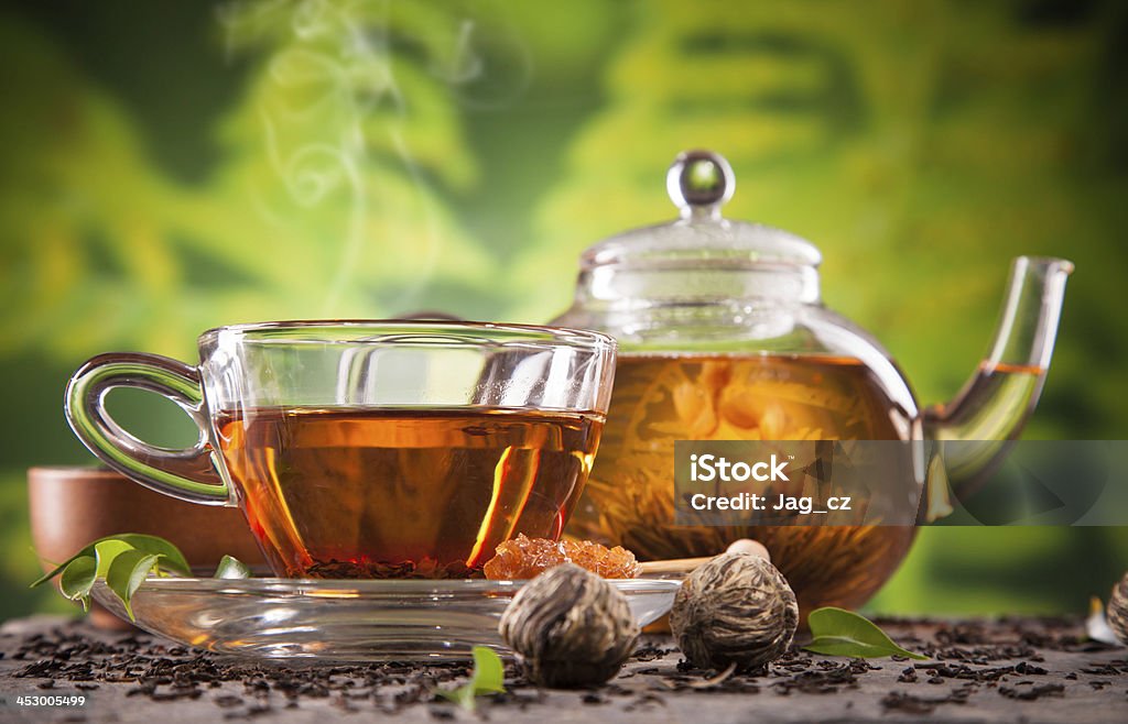 Blooming tea Blooming tea on blur green background Black Color Stock Photo