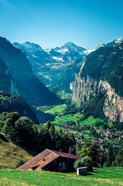 Lauterbrunnen  village with famous Staubbach Falls on the right hand side. Breithorn 3782m is visible in the front of the valley.